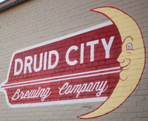 Druid City Brewing Company sign painted on the side of the building. 