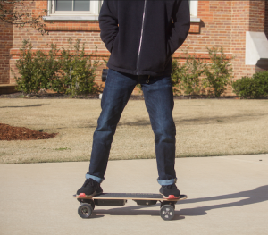 UA Student riding skateboard